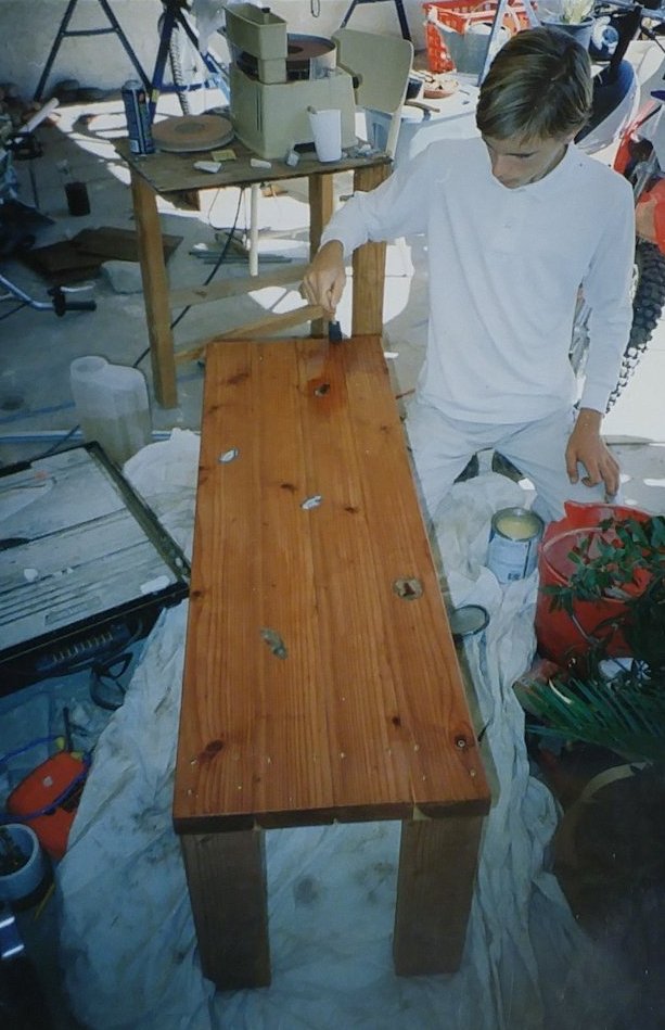 Image of Roger building a redwood coffee table at age 13.